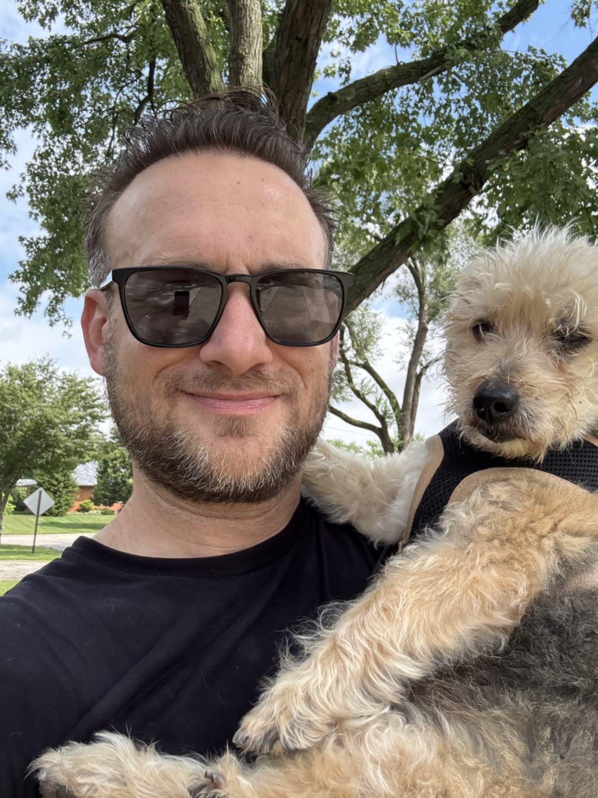 Brandon with a dog outdoors